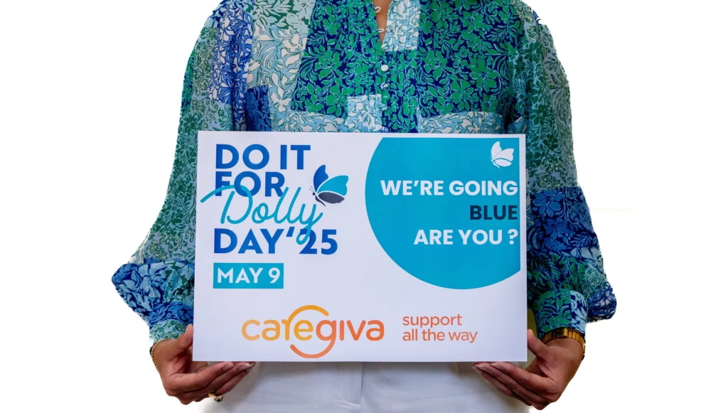 image of women holding a poster for Dolly Day