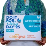 image of women holding a poster for Dolly Day