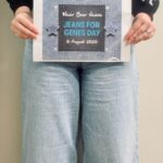 Person holding a poster promoting genes for jeans day.